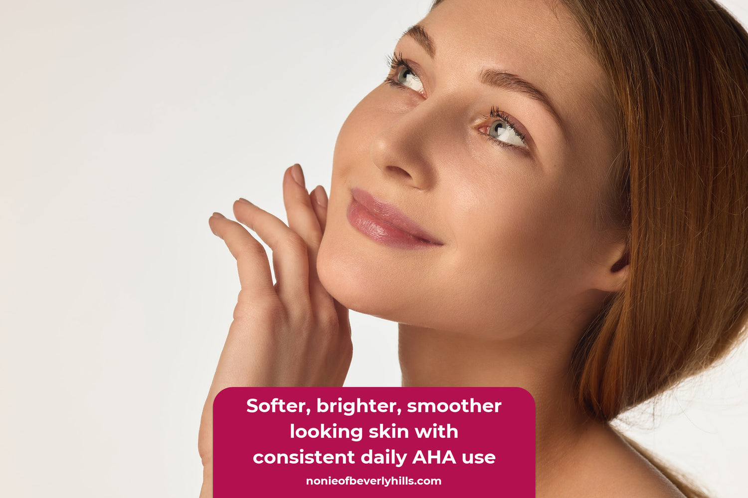 Close up of a woman’s cheek and jawline showing smooth, glowing texture after AHA use. AHA skincare helps refine texture, brighten tone, and smooth the appearance of fine lines.