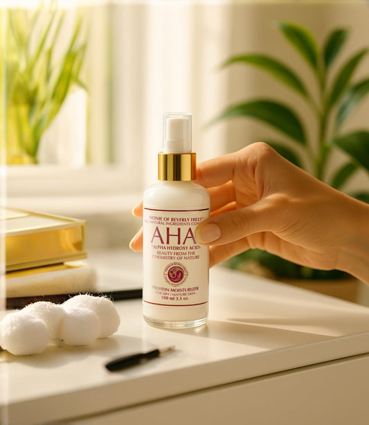 Nonie of Beverly Hills AHA Protein Moisturizer for dry and mature skin in a bottle next to cotton balls on a table