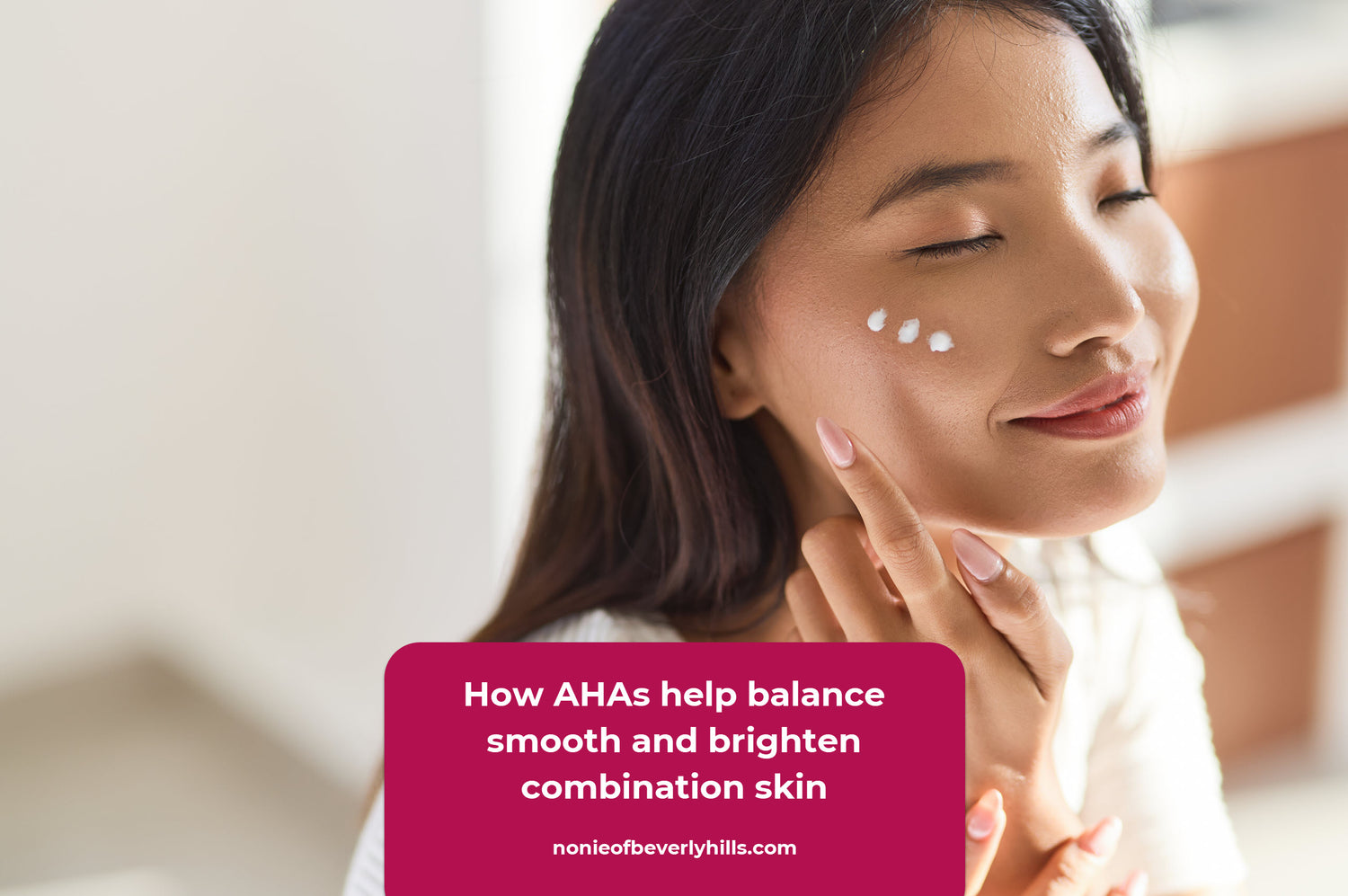 Woman applying lightweight AHA moisturizer ideal for normal and combination skin. AHAs help refine texture and balance the skin for a smoother clearer look.