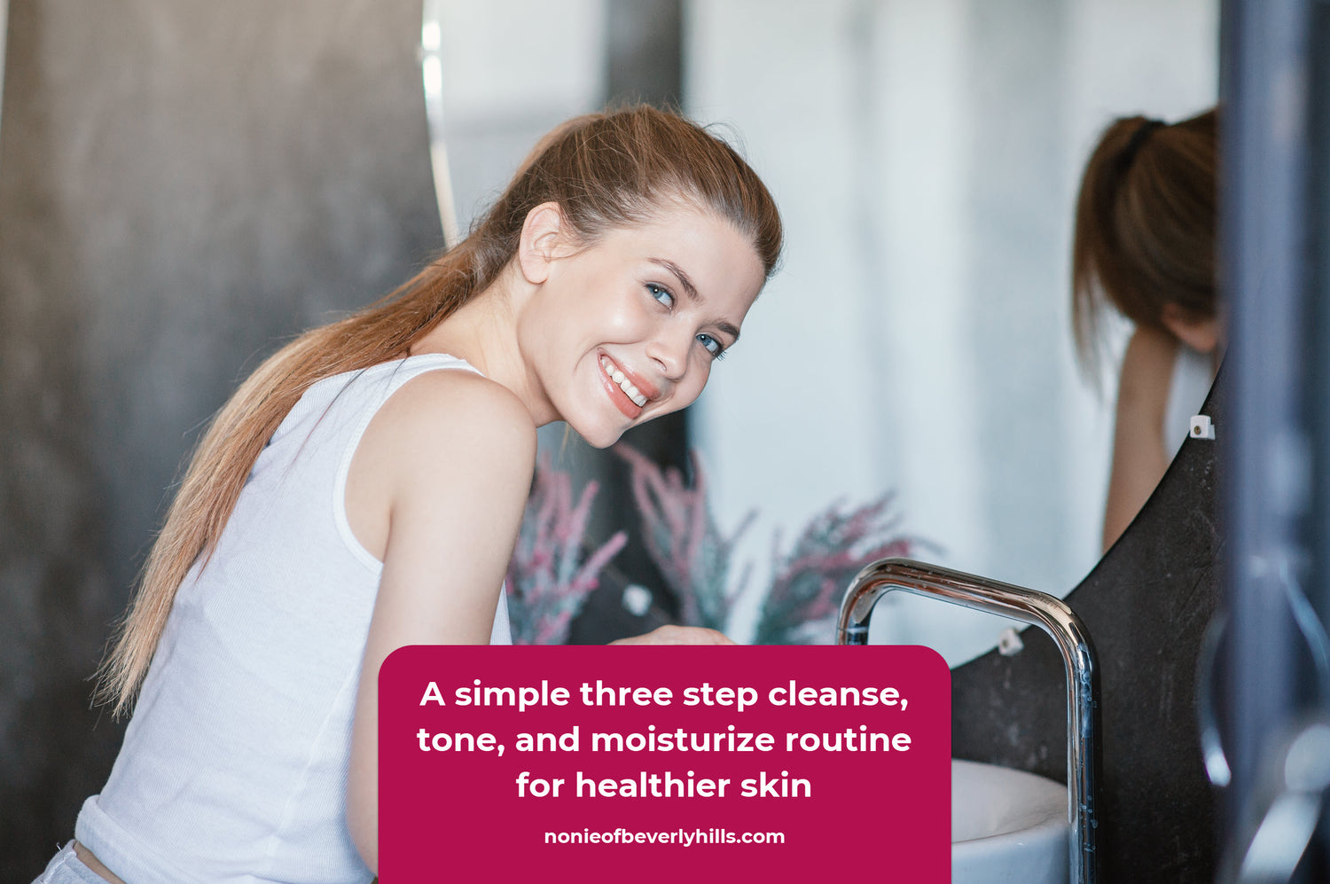 Woman cleansing and toning her face at a bathroom sink while using AHA skincare products. A consistent cleanse, tone, and moisturize routine supports long term clarity and softness.