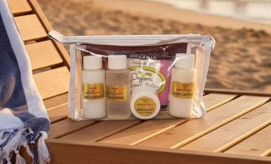 Nonie of Beverly Hills travel kit in a bag on the beach